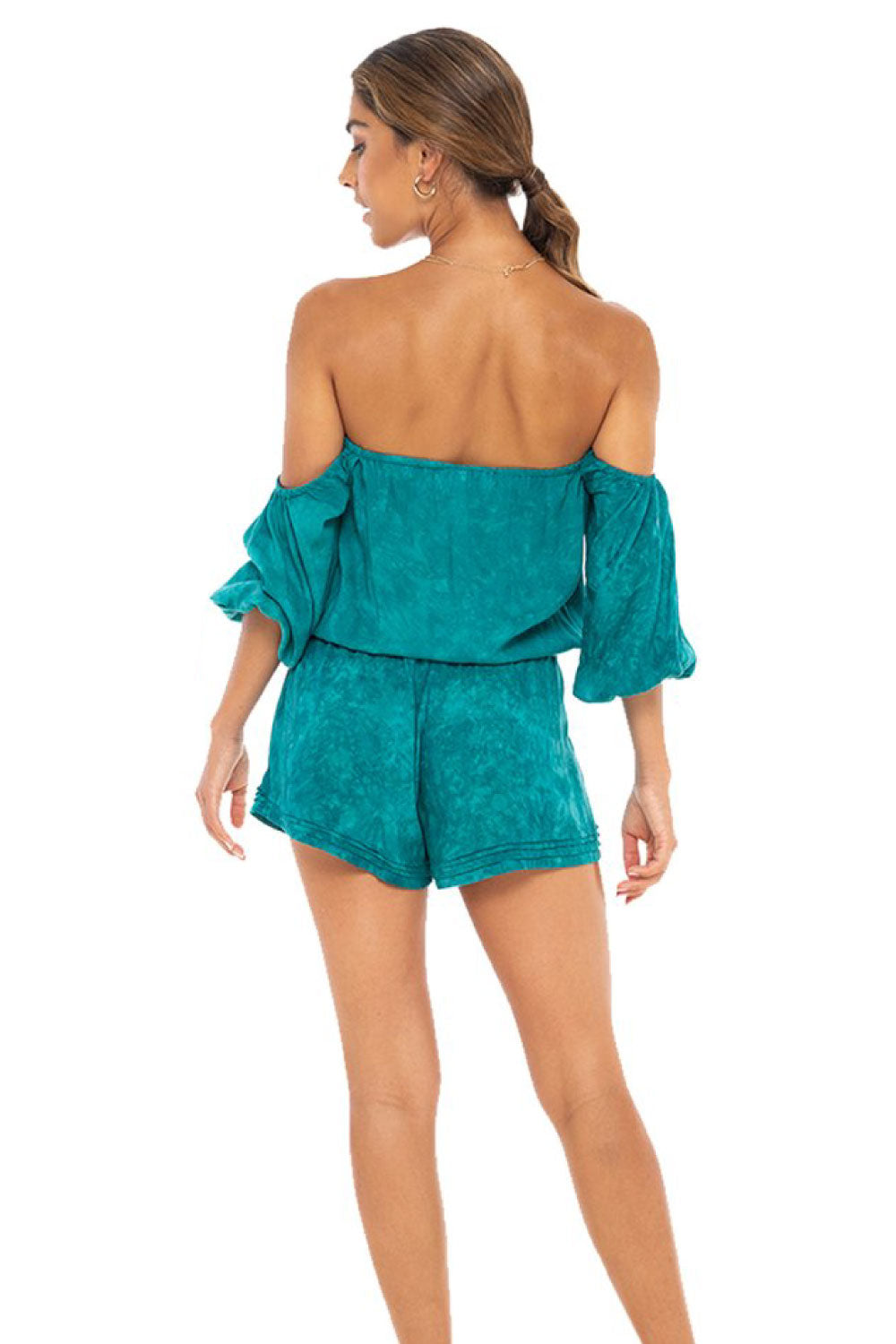 Image of the back of Kush Clothing's Jessie Romper on a model.