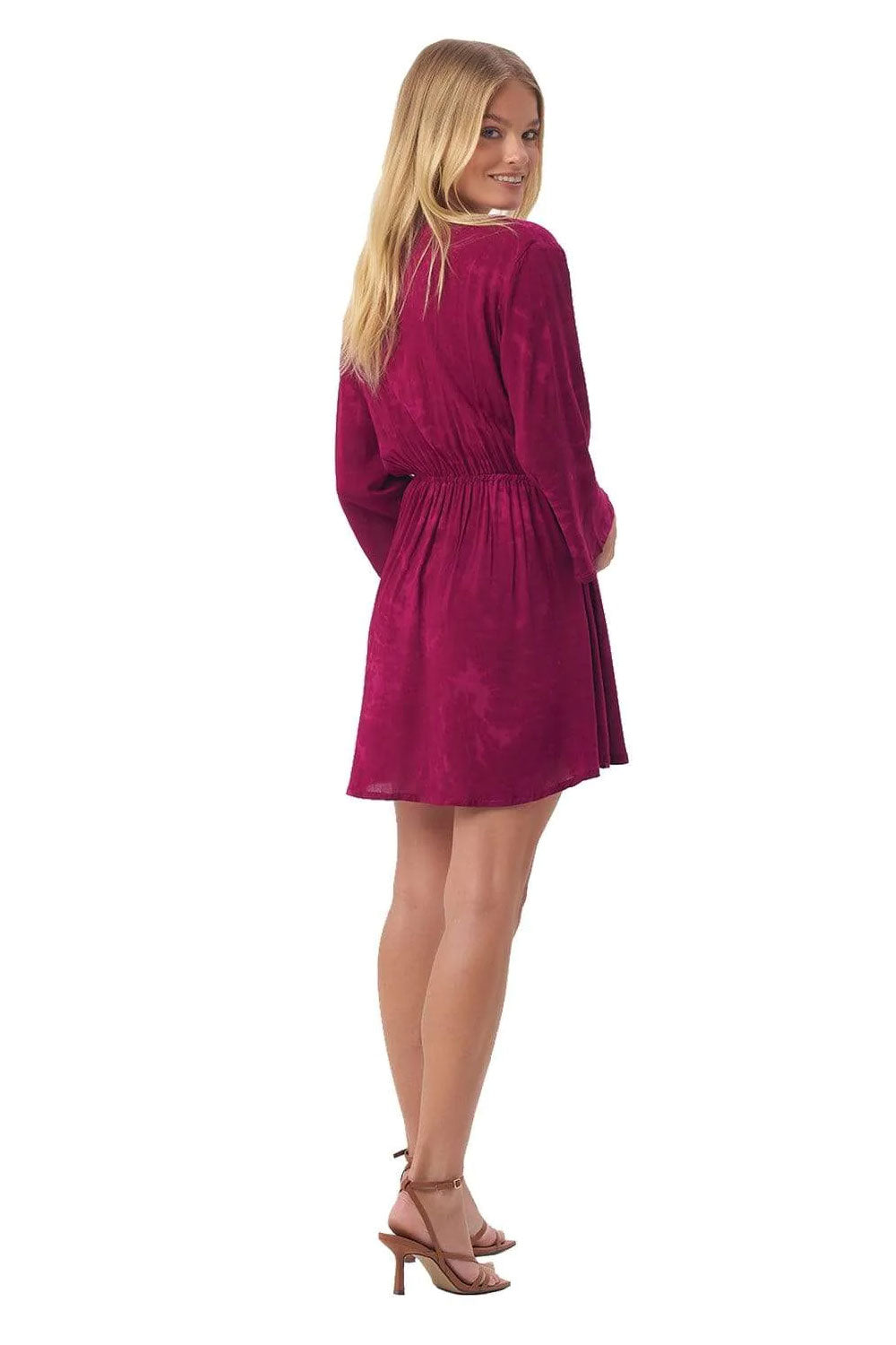 Image of the back of the Sundown Nayana Mini Dress in Fuschia on a model.