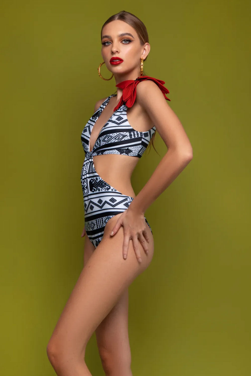 Image of the side of Mar A Mar's Notte One Piece Swimsuit on a model.
