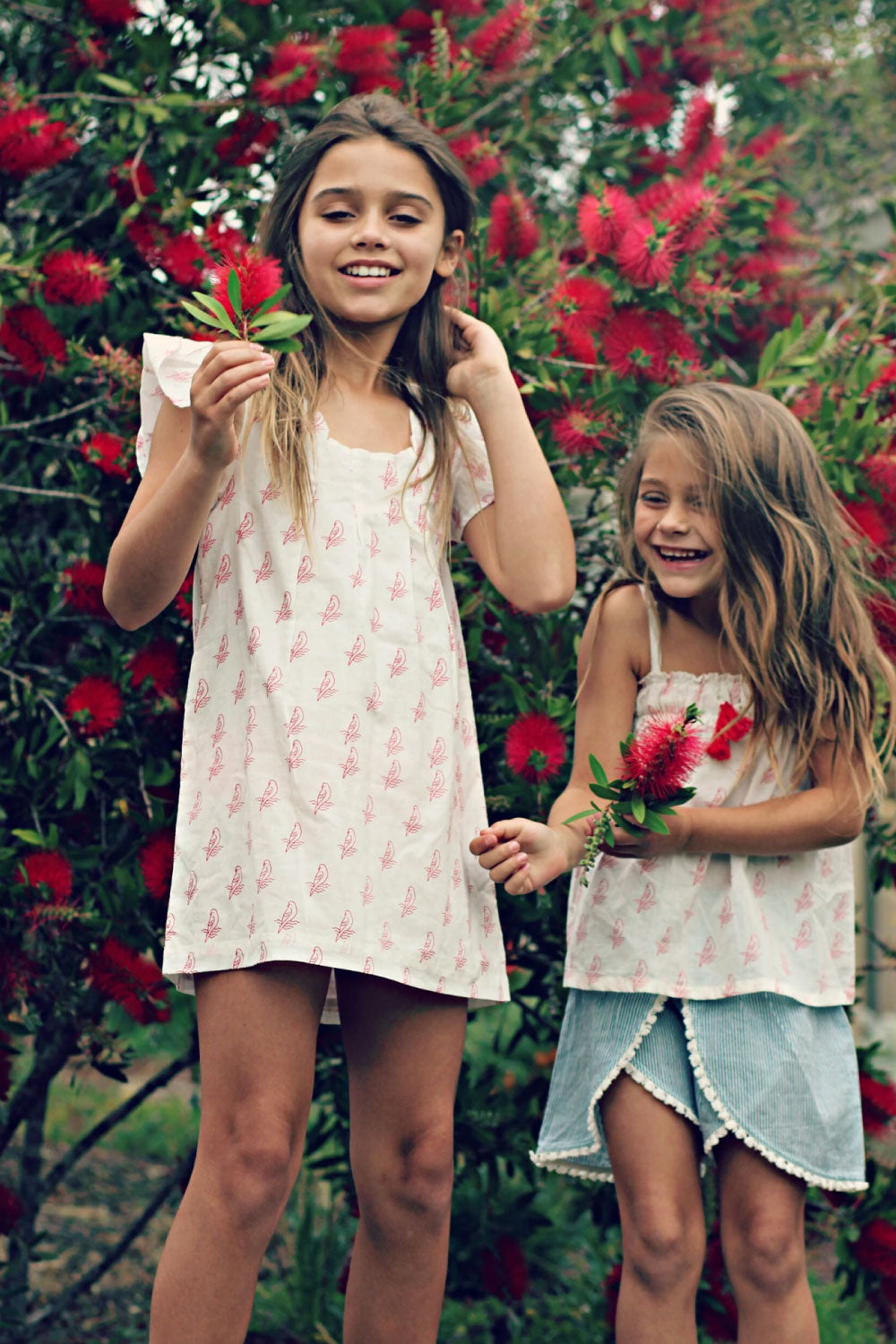 Image of child wearing the Alice Parrot Dress.