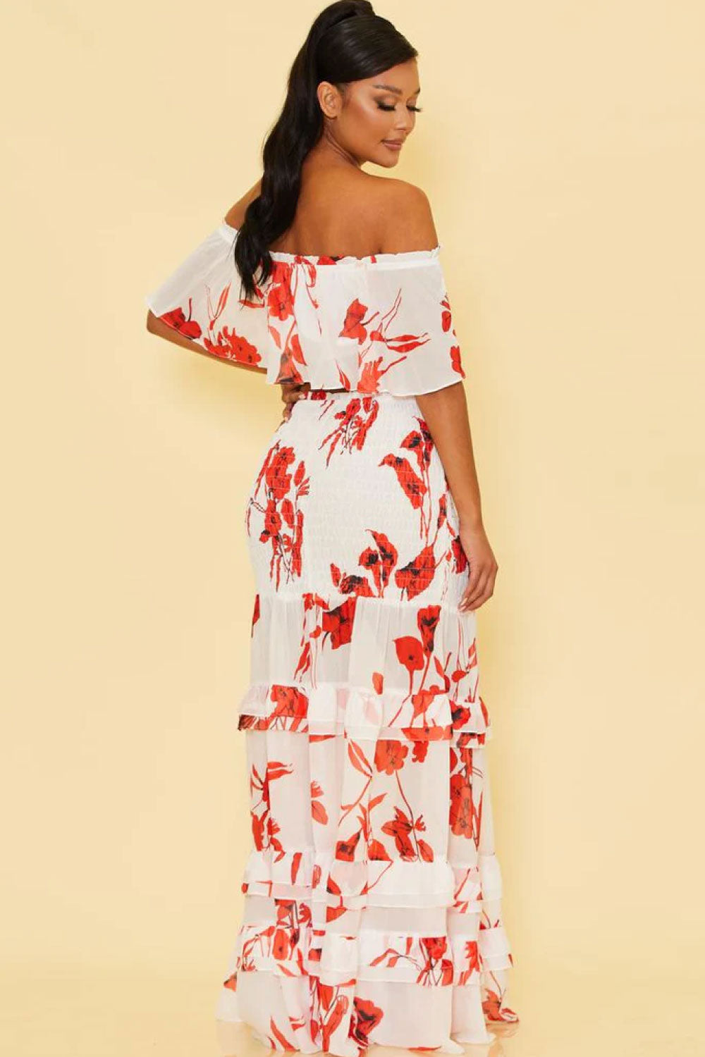 Image of back of Luxxel's Red Floral Two-Piece Skirt Set on a model.
