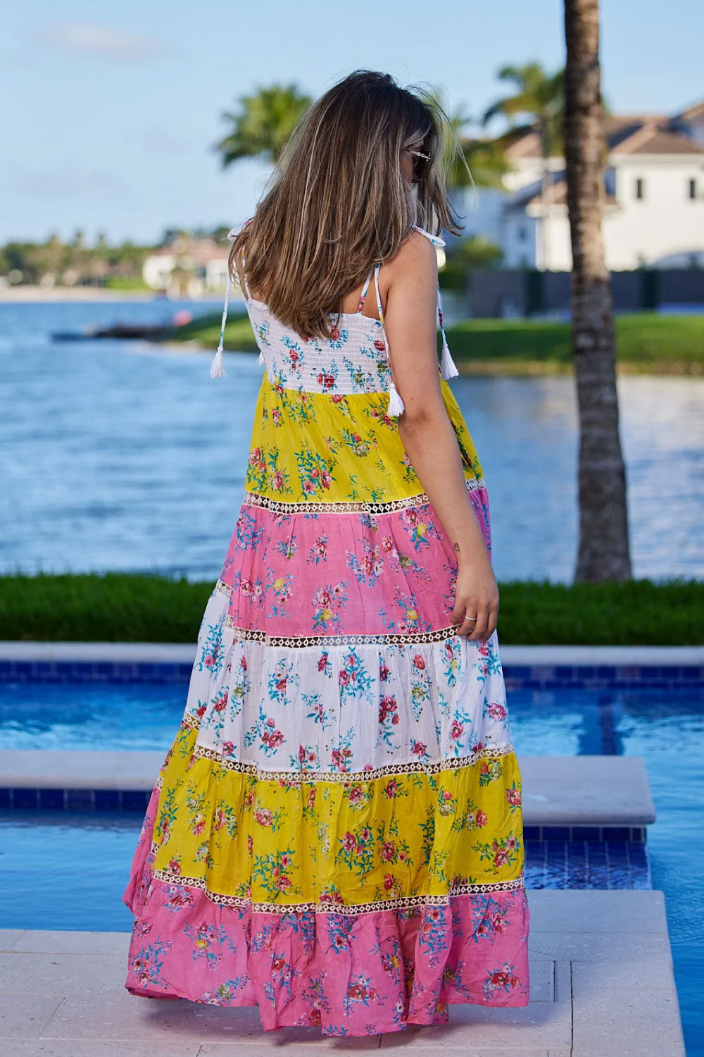 Image of the back of Ranee's Orange Kaftan Dress on a model.