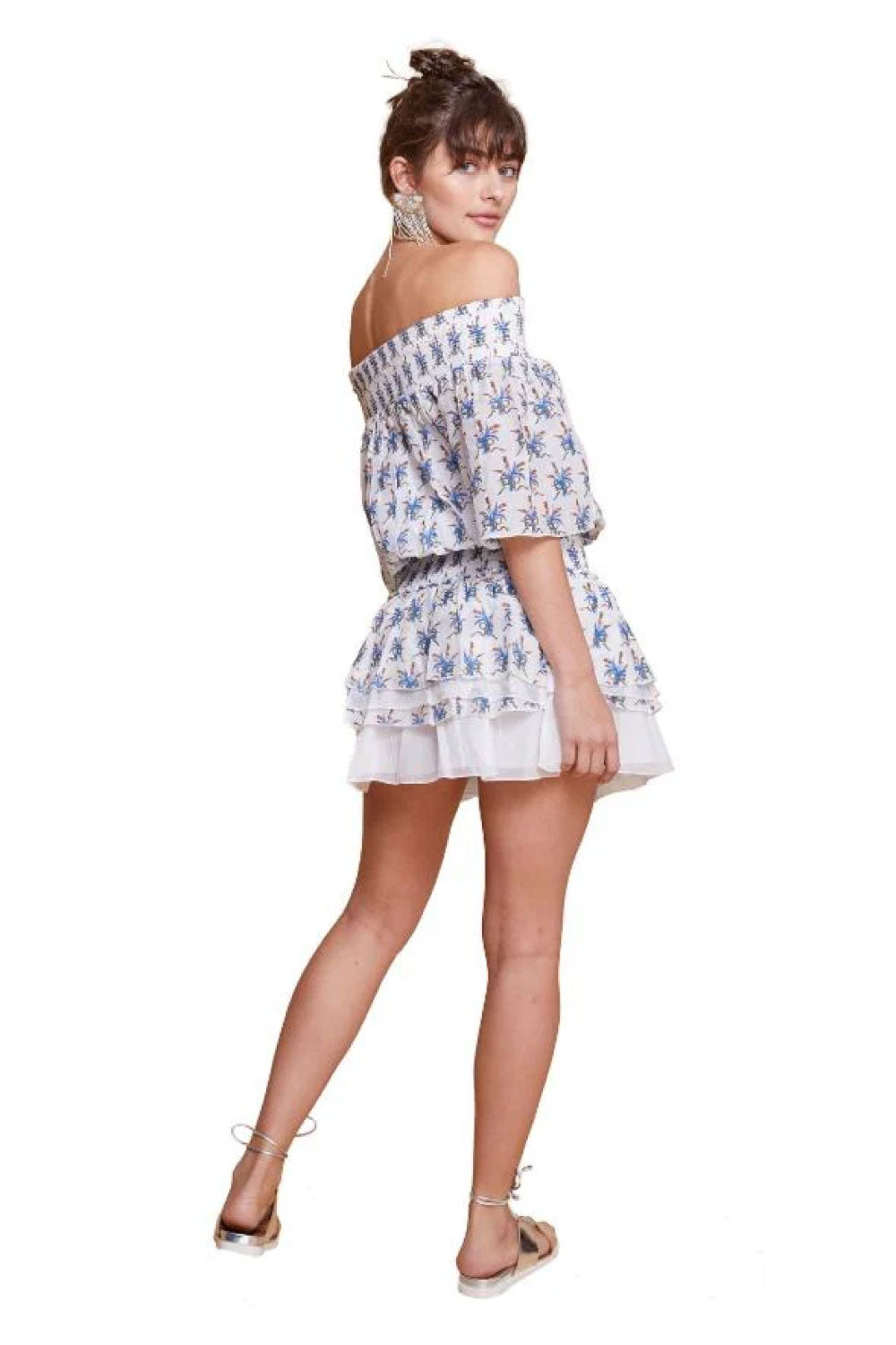 Image of the back of Guadalupe Design's Anais Mini Dress in Blue and White on a model.