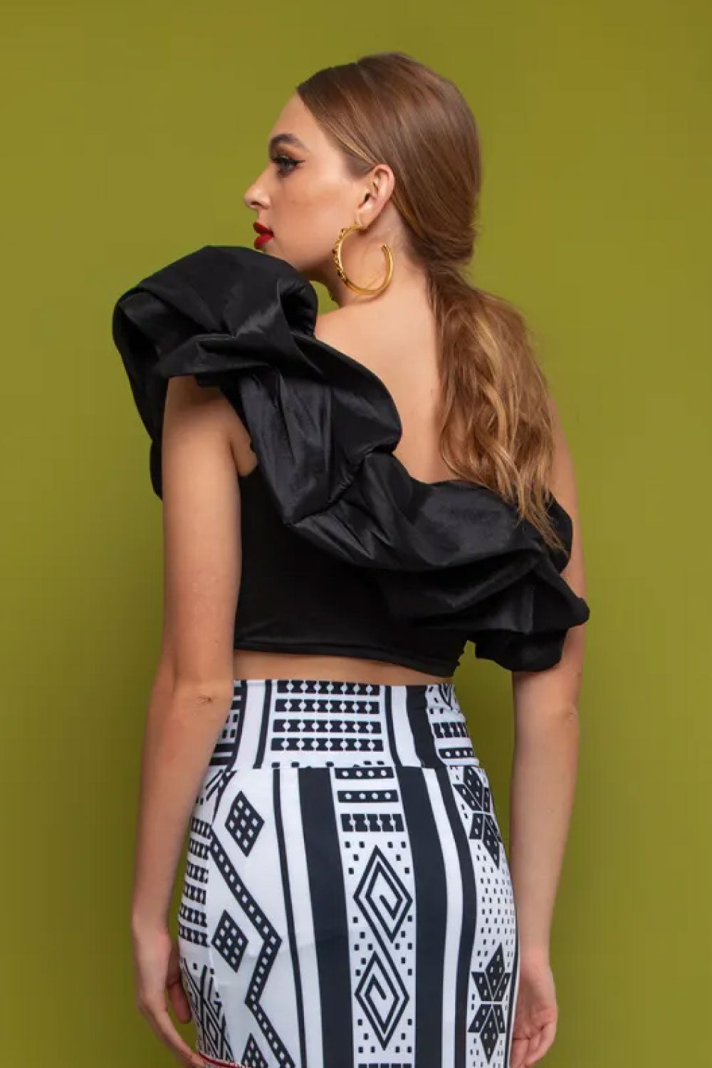 Image of the back of Mar A Mar's Notte Top in Black on a model.