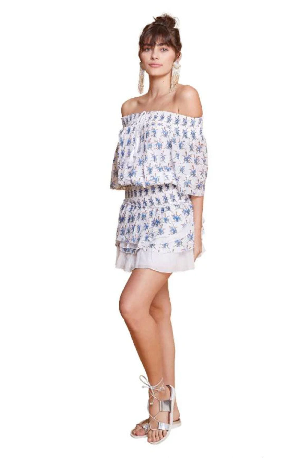 Image of the front of Guadalupe Design's Anais Mini Dress in Blue and White on a model.