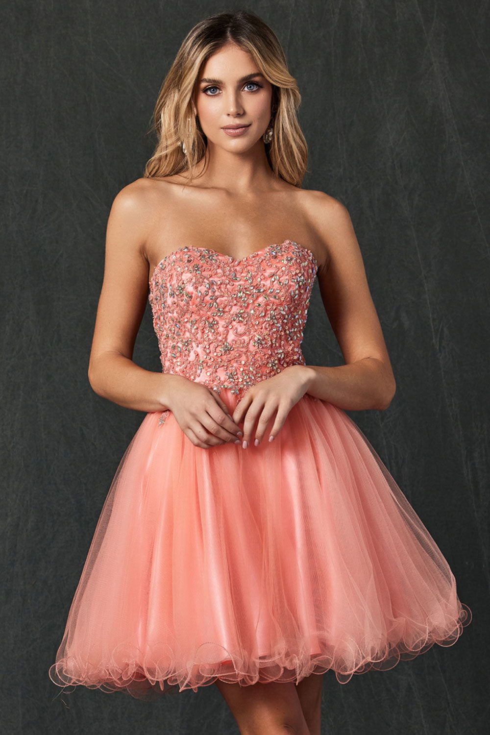 Image of the front of Juliet's Flirty Strapless Prom Dress on a model.