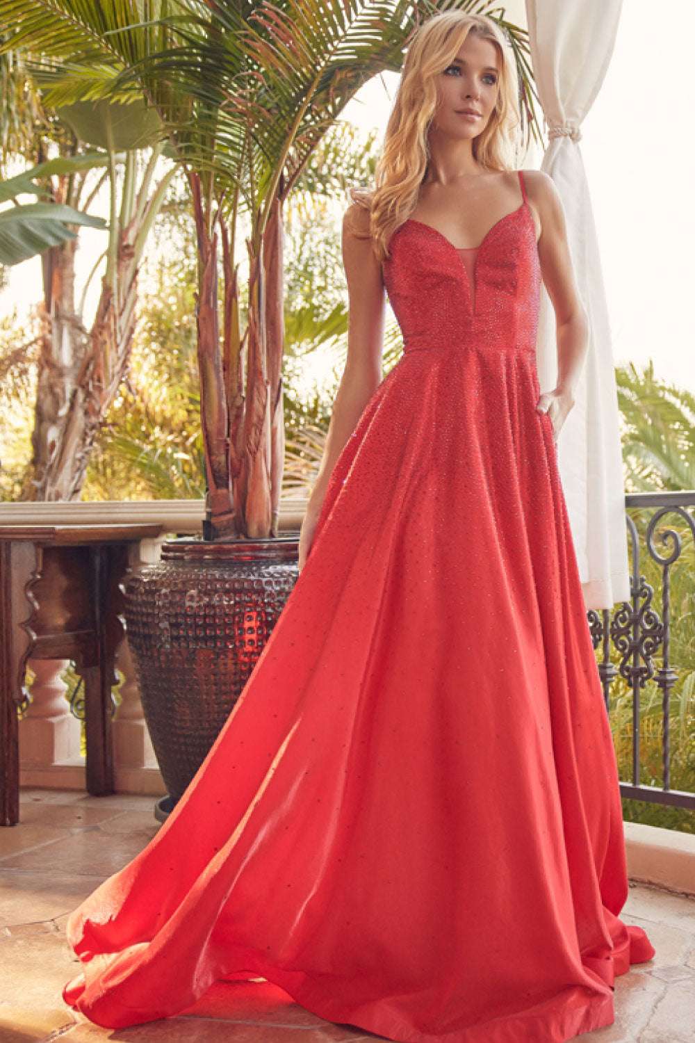 Image of the front of Juliet's Long Sparkly Gown in Red on a model.