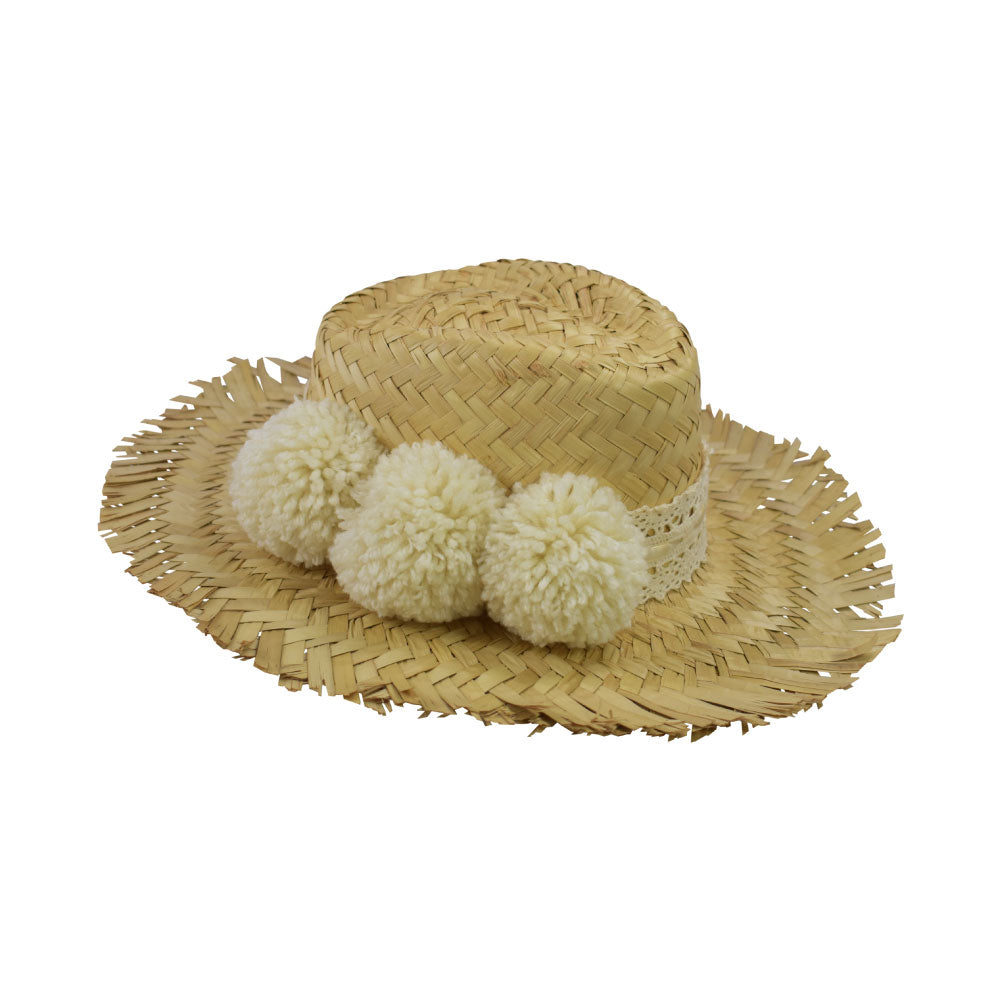 Side view of the Alfredo Barraza Straw Hat with Cream Pom-Poms.