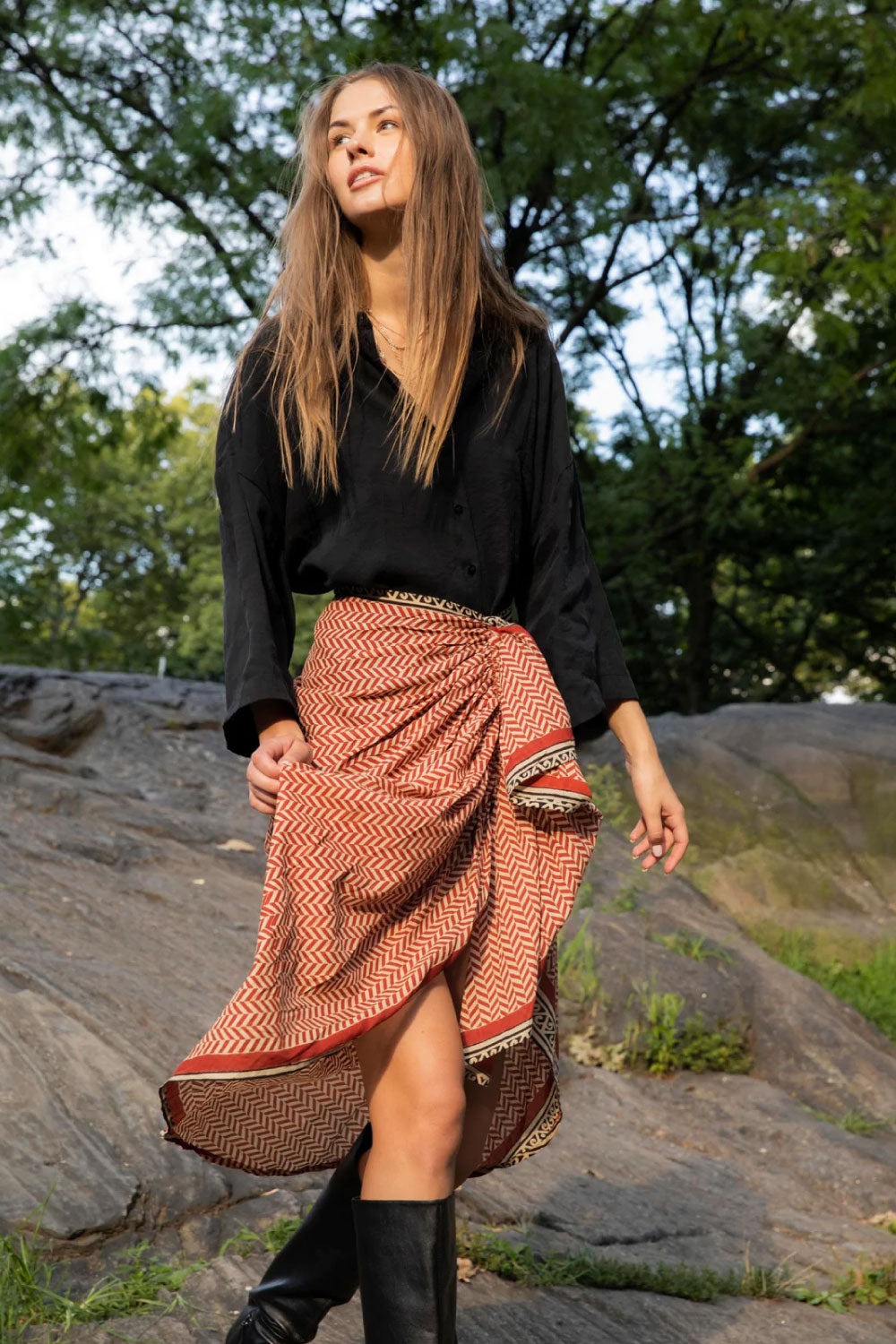 Image of the front of Guadalupe Design's Ashi Pareo Skirt in Red on a model.