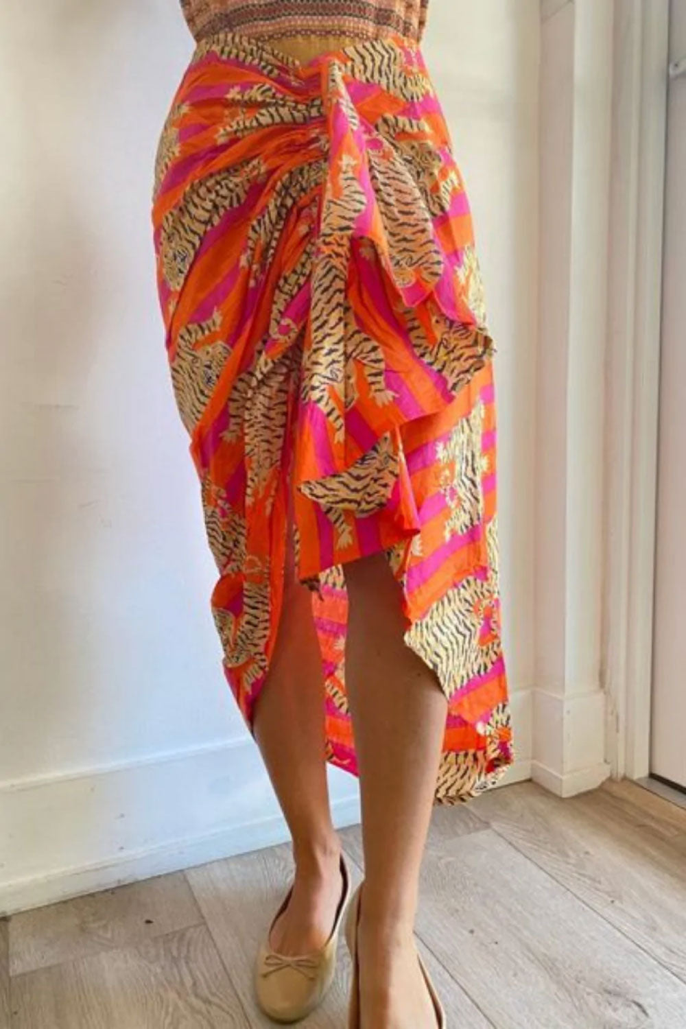 Image of the front of Guadalupe Design's Tiger Pareo Skirt in Orange.