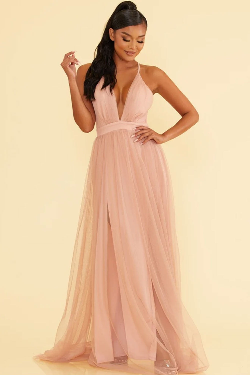 Image of the front of Luxxel's Elegant Deep V-Neck Maxi Dress in Blush on a model.