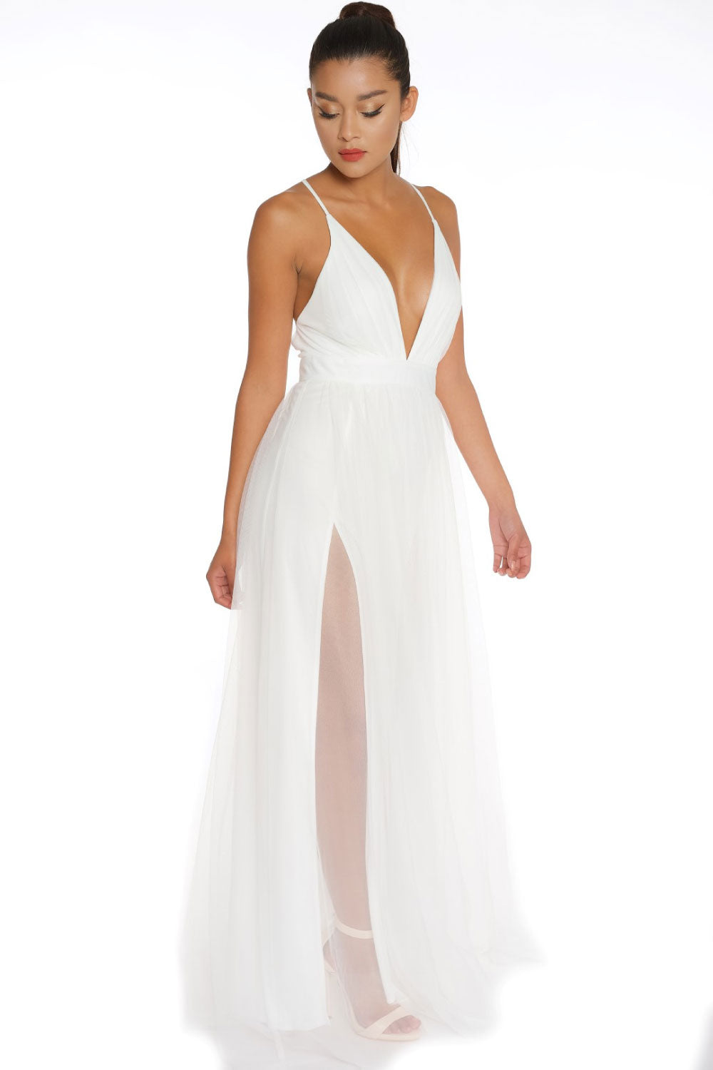 Image of the front of Luxxel's Elegant Deep V-Neck Maxi Dress in White on a model.