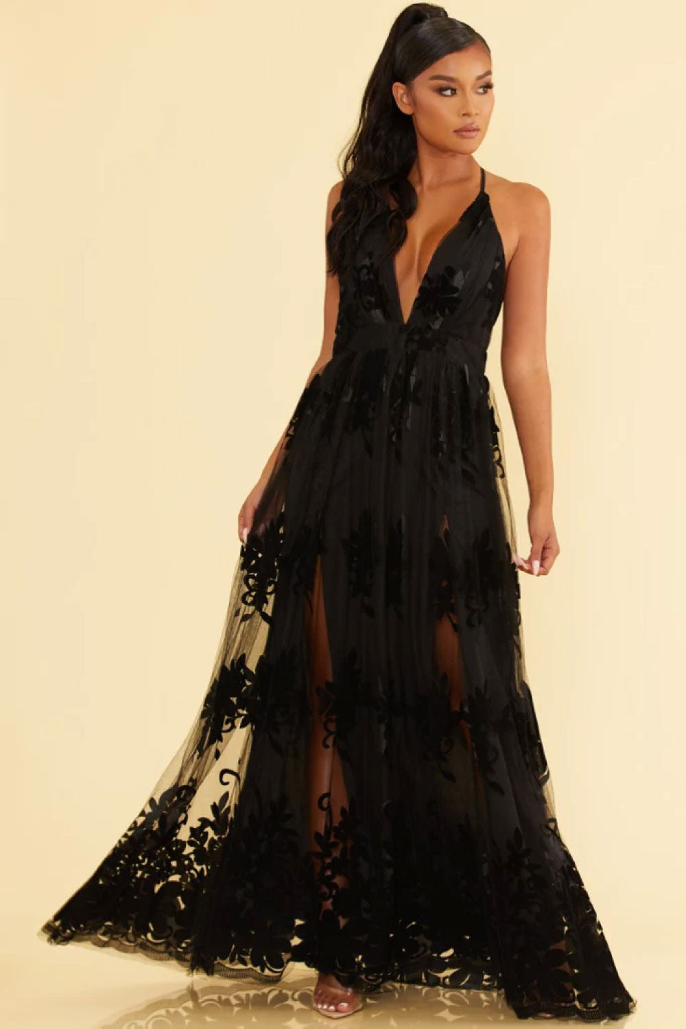 Image of the front of Luxxel's Elegant Lace Gown in Black on a model.