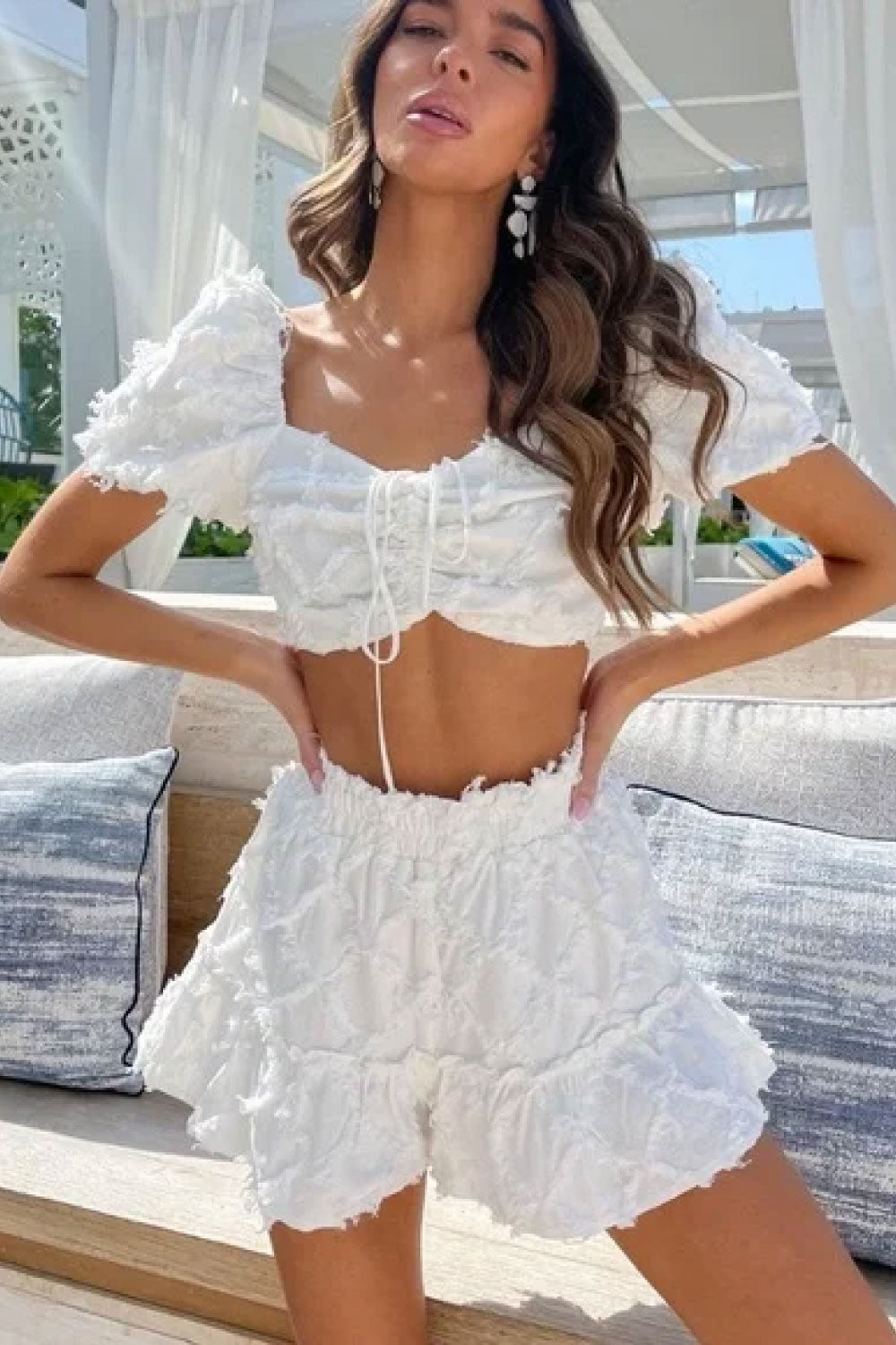 Image of the front of Luxxel's Textured Shorts and Top Set in White on a model.